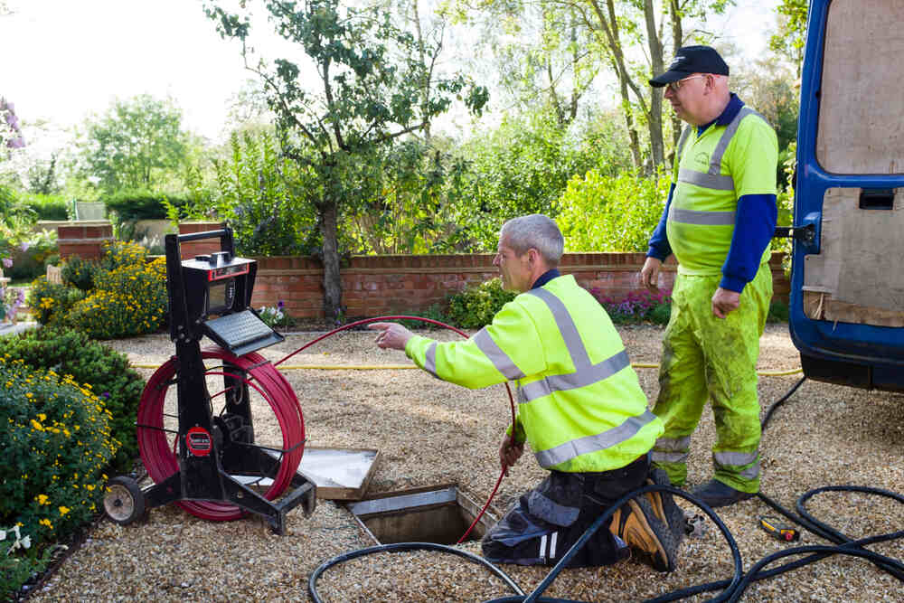 technicians performing sewer camera inspection